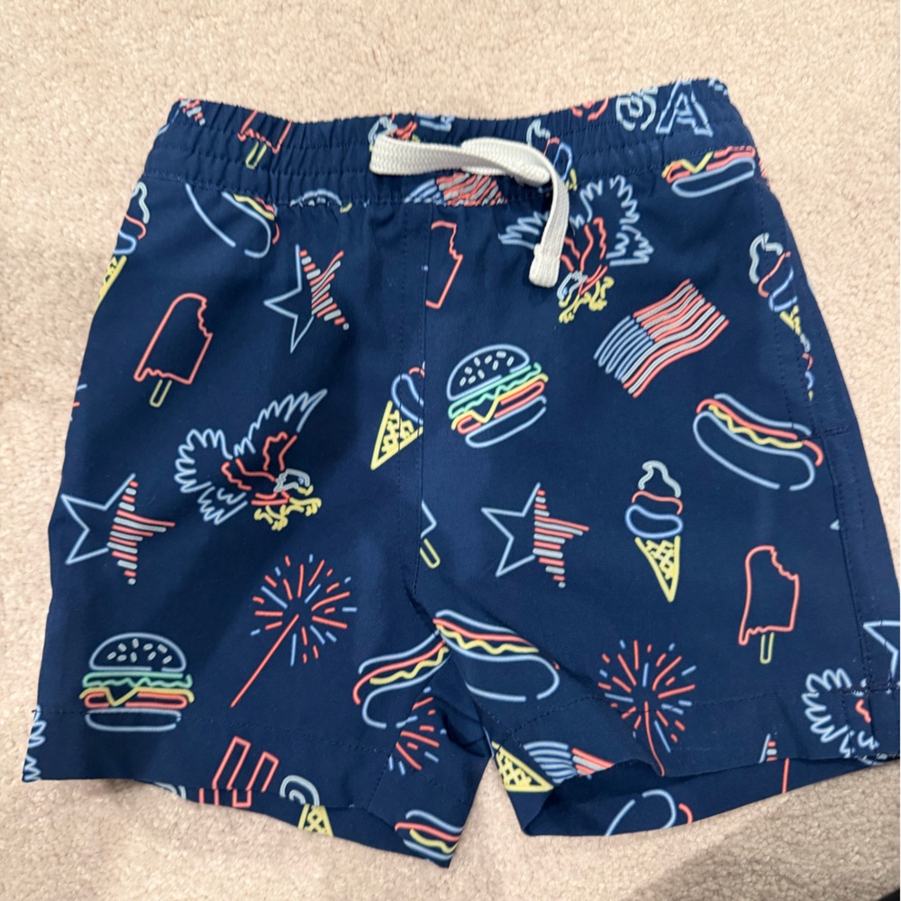 chubbies Navy Kids Swim Trunks with Neon Snack and Flag Motifs